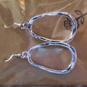 Beautiful oval-ish silver Hoop Earrings. Mild curves. Simply perfect.